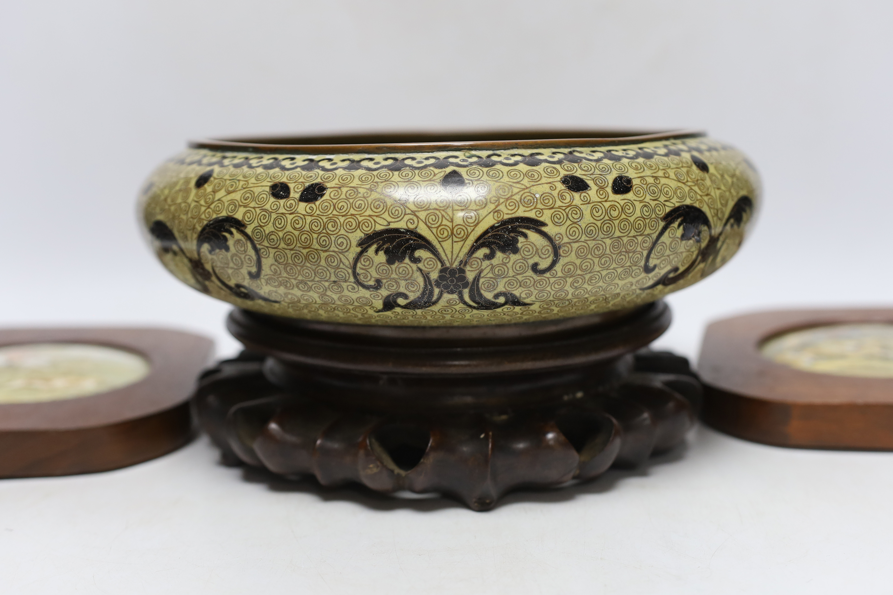 A Chinese cloisonné enamel bowl on a wooden stand, a pair of cloisonné jars with covers, and four 19th century Prattware pot lids, largest 25cm in diameter